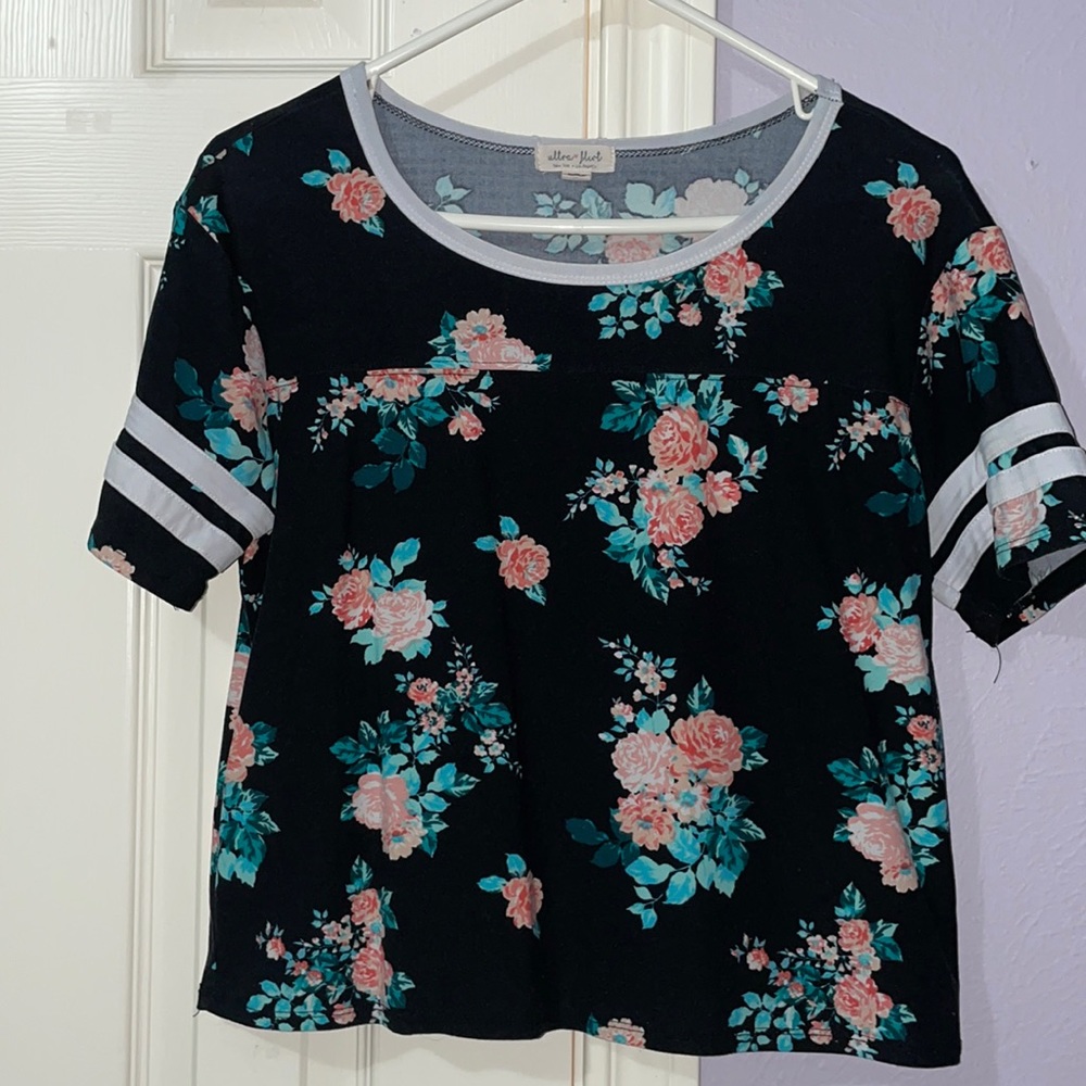 black tee with flowers covering shirt